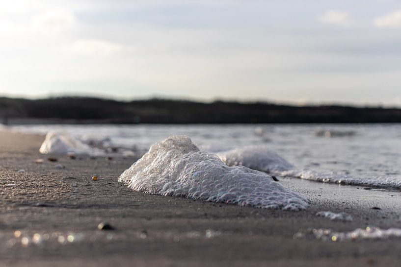 Sea foam on the beach by Marjolein Albregtse