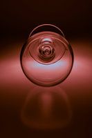 Wine glass on soft red coloured background
