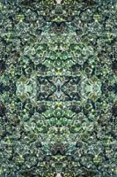 Blue green seawater, stones and symmetry