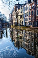 Reflection of canal houses in the water of the old canal in Utrecht