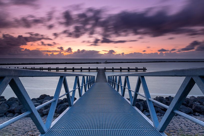 Jetty at the IJsselmeer at sunset by Marcel van den Bos