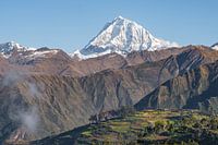 Snowy Andean Peak amidst Rolling Hills