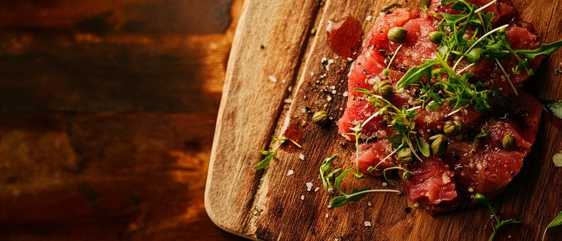 Fresh beef tartare on a wooden board by Poster Art Shop