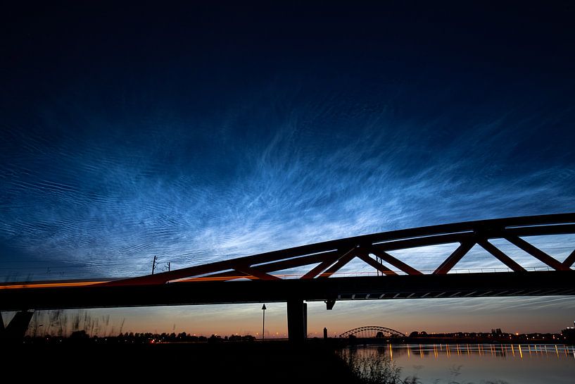 Luminous night clouds above railway bridge the Hanseatic Arch near Hattem - Zwolle by Stefan Verkerk fotografie