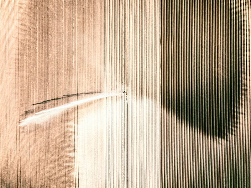 Irrigation pivot gun machine spraying water on a field by Sjoerd van der Wal Photography