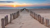 Wave breakers at sunset on the beach near Oostkapelle