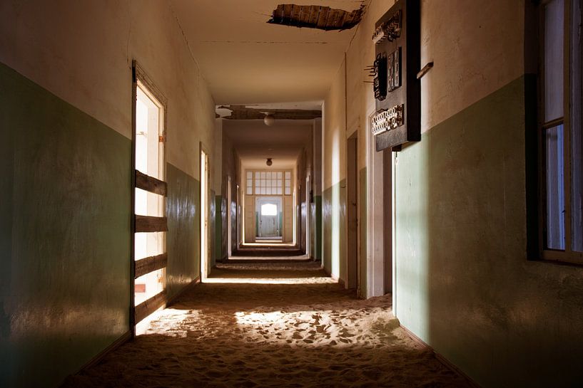 Abandoned 'ghost hospital' in Kolmanskop, Namibiē by Mark Zoet