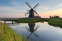 Hatsumer mill with reflection in the water.
