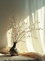 Vase with dried branches in sunlight