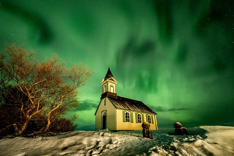 Northern lights over a church in Iceland by Marco Verstraaten