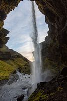 Behind the waterfall