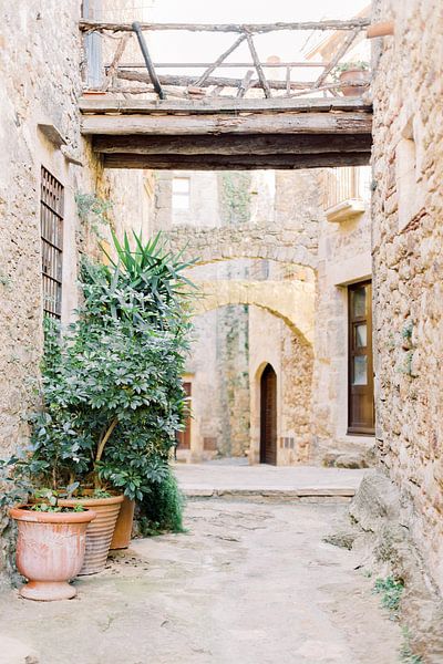 Medieval village Spain | Little street with old bricks and bridges | Travel photography art print by Milou van Ham