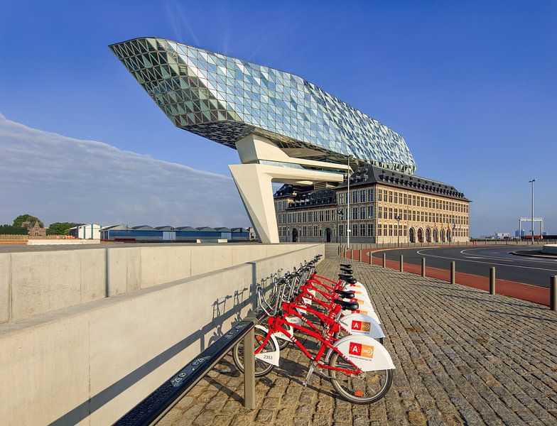 Antwerp Port House against blue sky with bike station  by Tony Vingerhoets