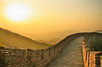 Sunset on the great wall of China, the air is saturated with smog - a red sunset