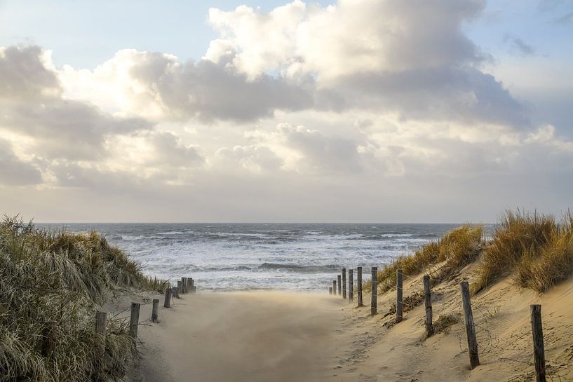 Beach, sea and sun on a stormy evening! by Dirk van Egmond