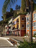 Colourful houses at the harbour of Parga.