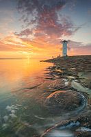 Mill beacon Swinoujscie at sunset