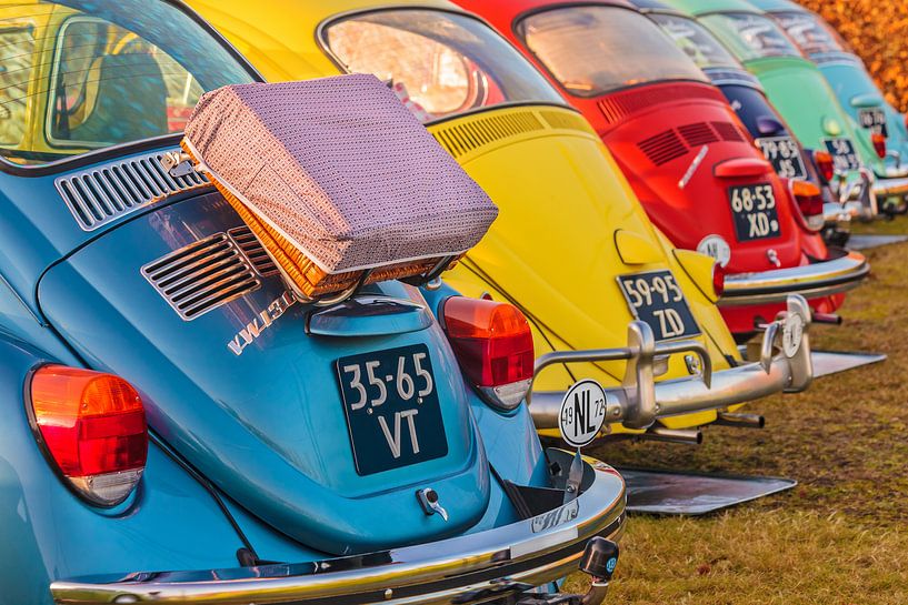 Row of classic Volkswagen Beetles by Martin Bergsma