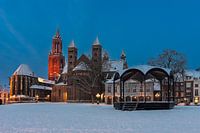 Saint Servatius basilica during blue hour with snow-covered vrijthof