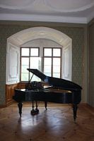 Piano with open characteristic window with beautiful light