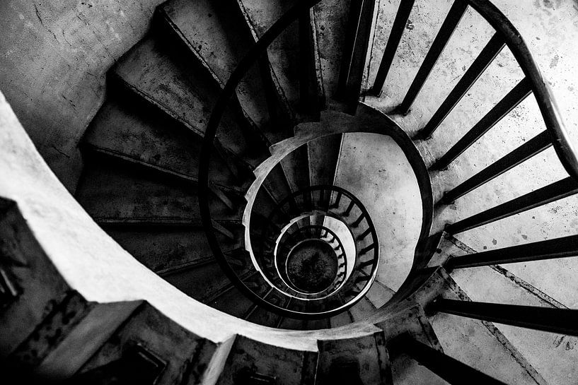Black and white urban spiral staircase down. by Ellis Peeters