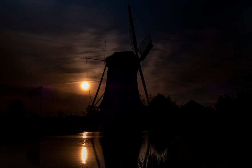 Pure Holland. The silhouette of a windmill at sunset. by Gianni Argese