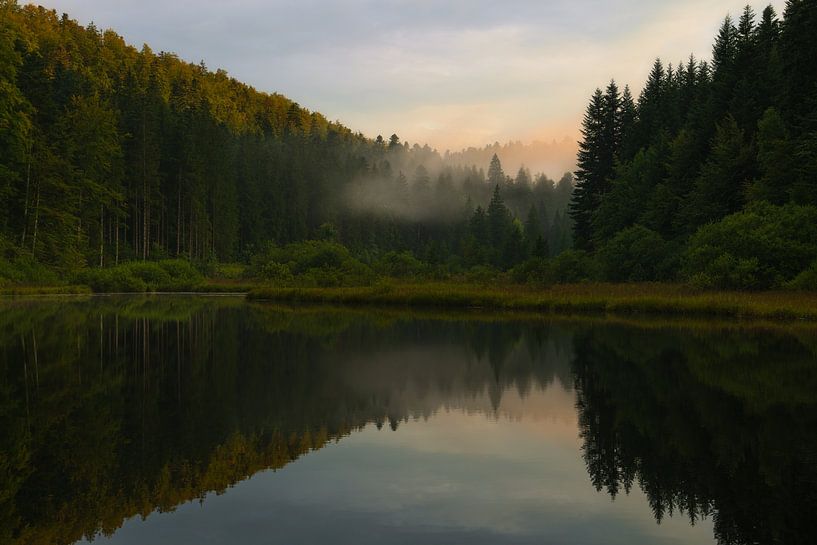 Sunset and beautiful reflections at a lake in the French Jura. by Jos Pannekoek