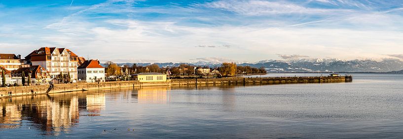 Panorama reflection Langenargen in Lake Constance and Swiss Alps in winter Germany by Dieter Walther