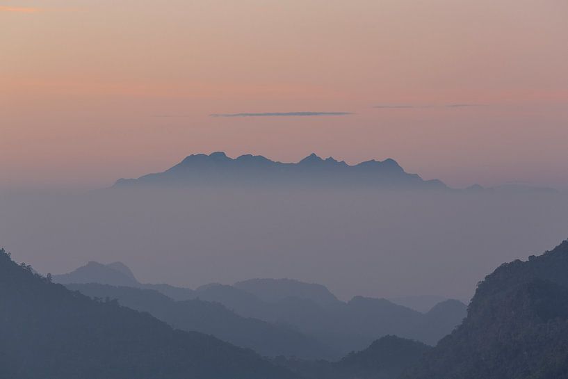 Mountain top rising out of the fog. by Johan Zwarthoed