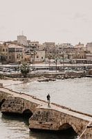 Man walks to Sidon Sea Castle in Lebanon