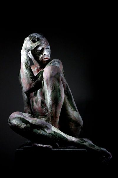 man photographed as a statue by Cor Heijnen