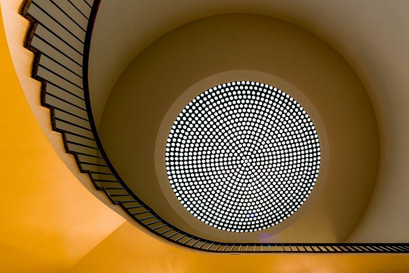 Yellow spiral staircase by Maerten Prins