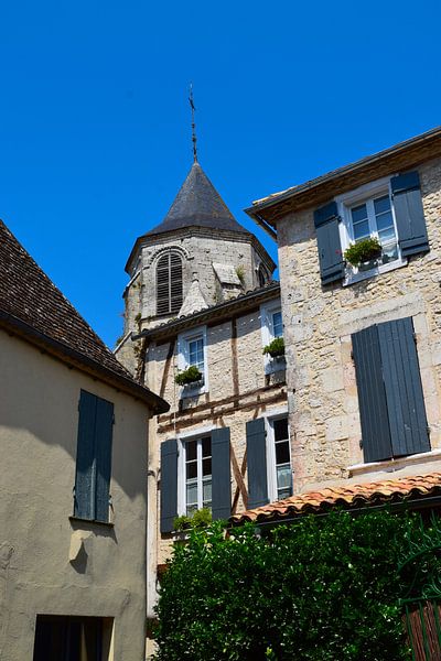 Typical French street in village in Dordogne. Wooden shutters, lanterns, stone walls. by Studio LE-gals