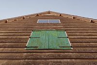Farm shed with green shutters