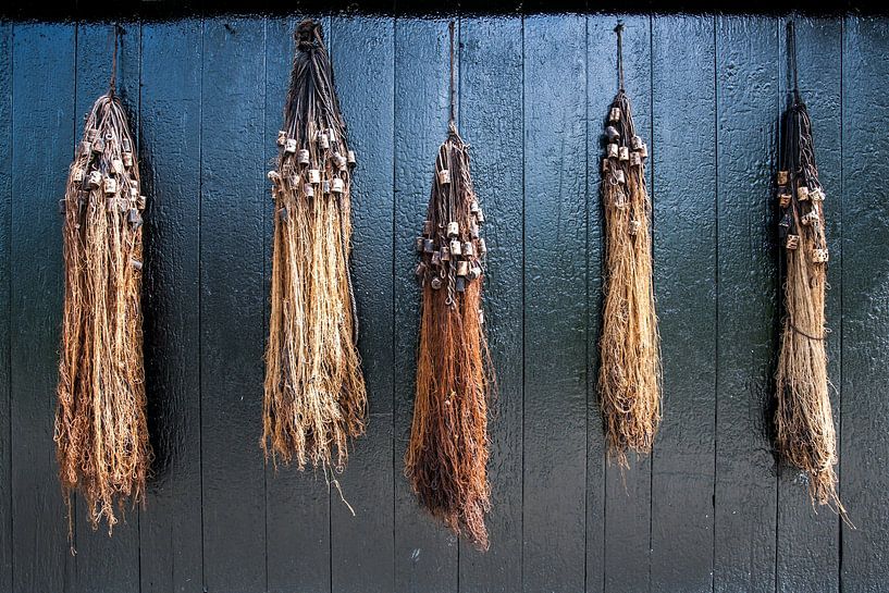 Eel nets on barn door by Robben