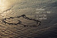 Een hart in het zand