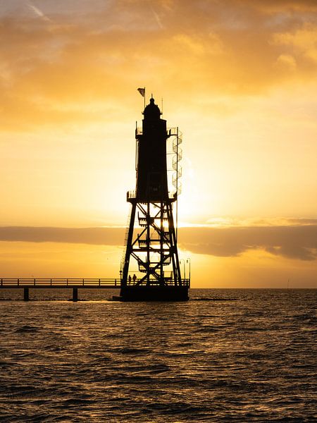 Lighthouse on the North Sea at sunset by Nils Steiner