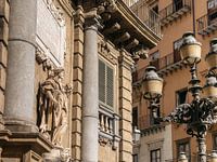 Mary statue and street lamp in Palermo, Italy