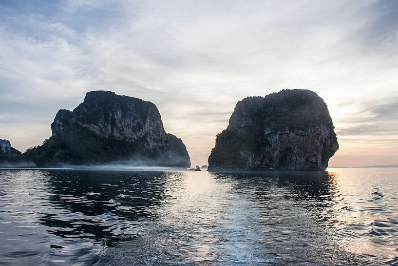 Early morning fog around cliffs at sea in Thailand by Anne Zwagers