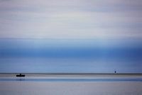 Fishing boat in contrast to nature