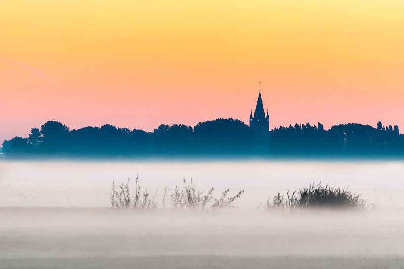 Church silhouet on the horizon by Peet Romijn
