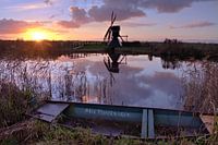Sunset with mill along the waterfront