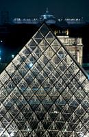 Pyramid of the Louvre and monuments seen from rooftops at night 8_6