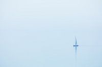 A sailboat in the coastal fog in Brittany