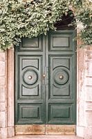 Green wooden front door Rome