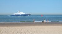 A blue yacht sails the Westerschelde