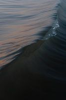 Small wave breaks like glass