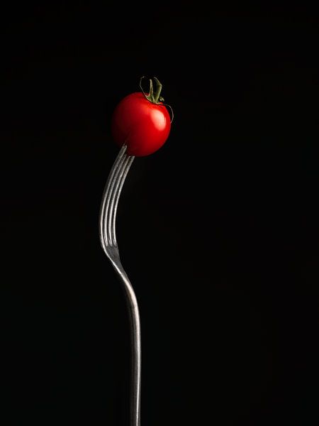 Cherry tomato on fork by Mariska Vereijken