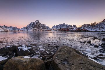 Snow covered mountains and frozen fjord in the morning sunlight in Reine on the Lofoten Islands in N by Robert Ruidl