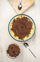 Cooking pudding with chocolate shavings